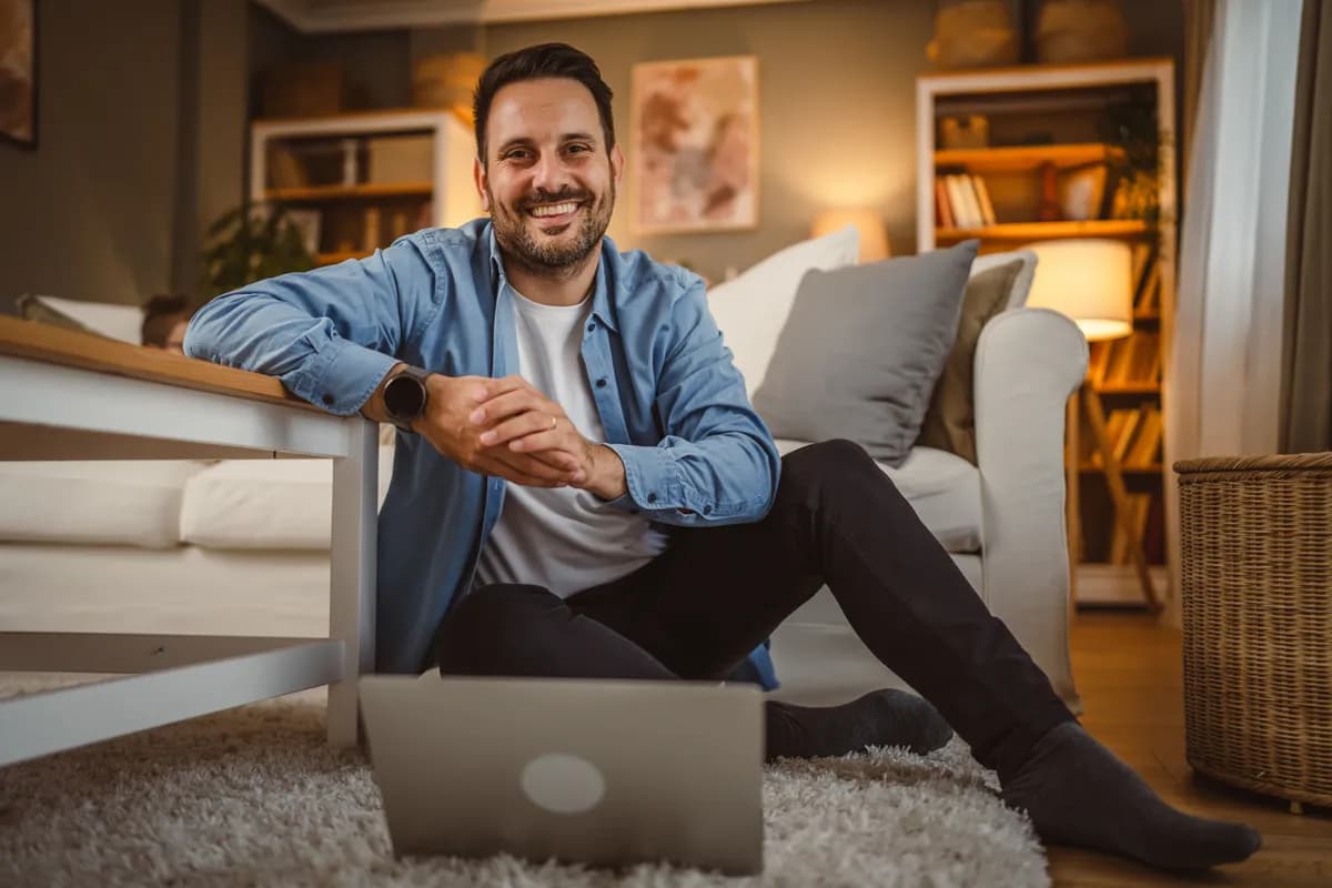 Man sitting on floor with laptop